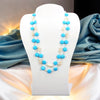 A magnesite turquoise and cultured freshwater pearl wire-wrapped statement necklace.