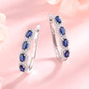 Blue & White Sapphire Halo Earrings in 14k White Gold