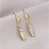 Goldtone Baguette Crystal Huggie Hoop Earrings