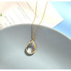 Goldtone Crystal Faceted Teardrop Pendant Necklace - White