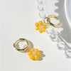 Goldtone Huggie Hoop Earrings With Yellow Flower