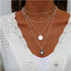 Silvertone Four Layered Necklace With Dainty Crystal - White