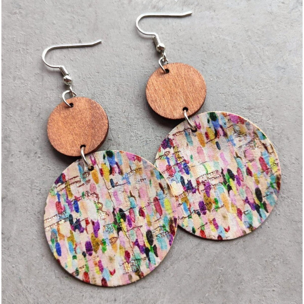 Silvertone dotted disk drop earrings in multi colours on cork